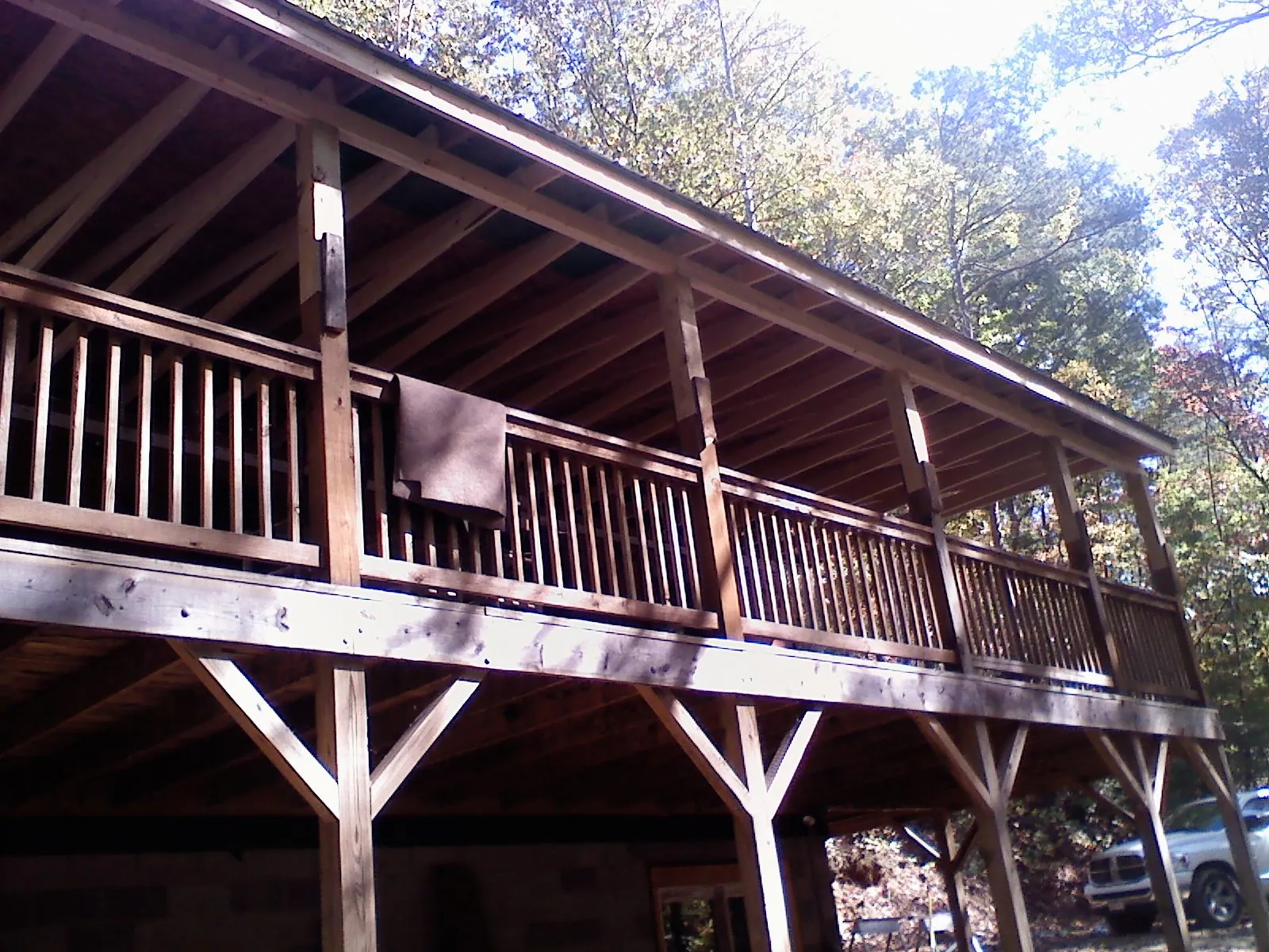 Timber framing under a new elevated porch and deck — Roof Leak Repair in Balsam by Roofing Brothers